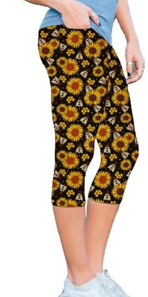 Adult wearing our Bees & Sunflowers Capri Leggings